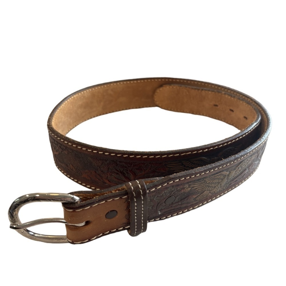 Brown leather belt embossed with American Eagles. Silvertone buckle. Size 39